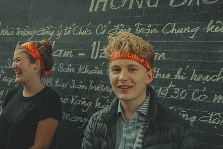Man Near Chalk Board With Text thumbnail