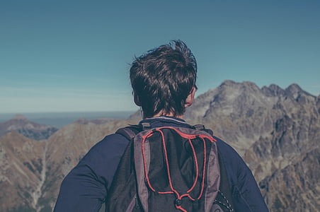 man seeing brown mountains taken at daytime thumbnail