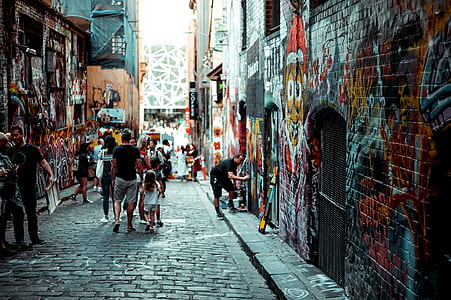 group of people standing on the sidewalk thumbnail
