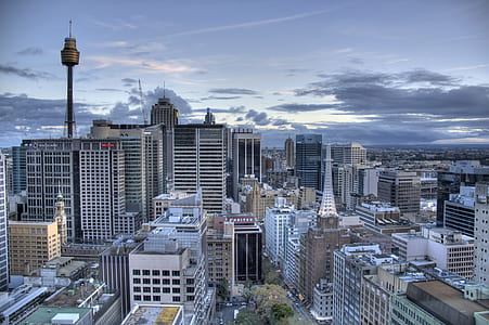 gray concrete buildings under gray sky thumbnail