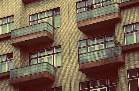 low angle photo of gray concrete building thumbnail