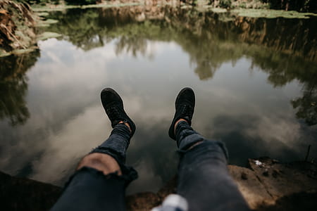 person sitting nearby lake thumbnail