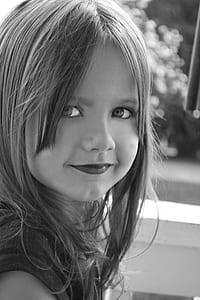 greyscale photography of smiling girl thumbnail