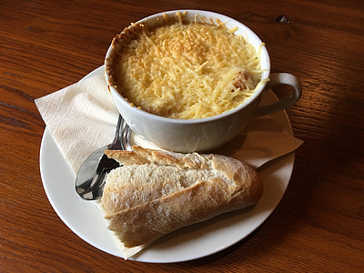 cheese on teacup beside bread on coaster thumbnail