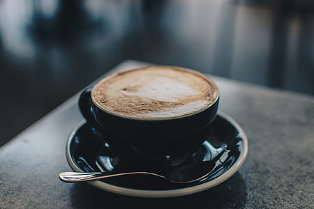 selective focus photography of latte cup on saucer thumbnail