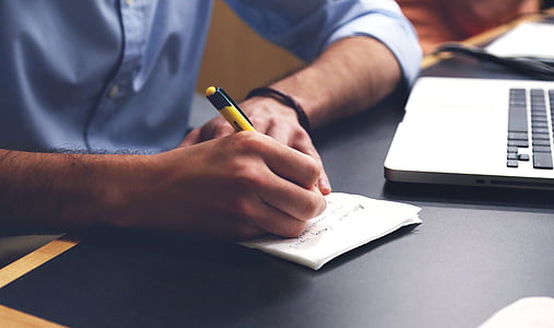 man writing on paper thumbnail