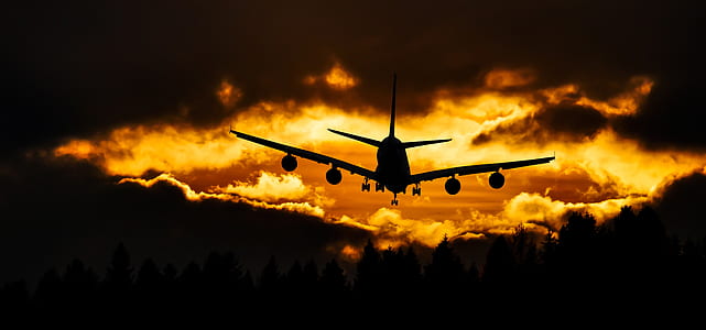 Airplane Silhouette on Air during Sunset thumbnail