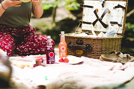 two bottles near picnic basket thumbnail