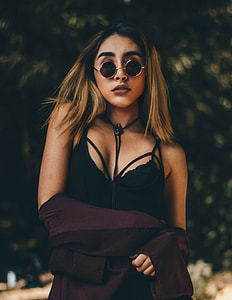 shallow focus photography of woman wearing black halter top thumbnail