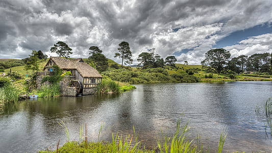 brown wooden house with lake thumbnail