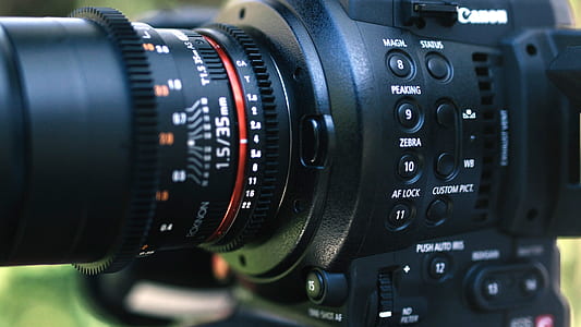 shallow focus photo of Canon camera thumbnail