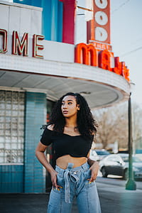 woman standing beside theater thumbnail