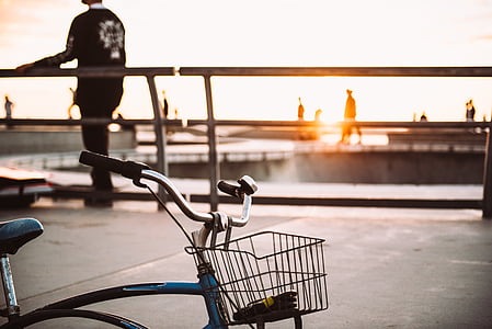 blue and gray bicycle during golden hour thumbnail