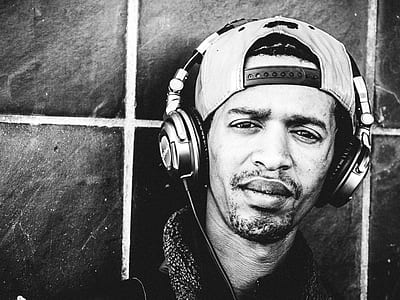 grayscale photo of man wearing headphones thumbnail