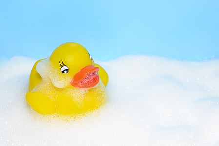 yellow rubber duckling on white foam thumbnail