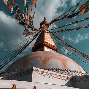 brown and gray mosque with buntings thumbnail