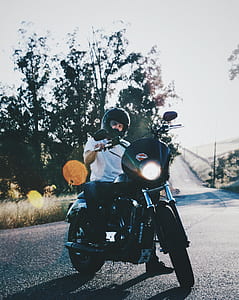 man riding on black motorcycle thumbnail