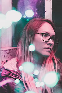 depth photography of woman in black framed eyeglasses thumbnail
