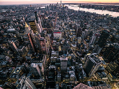 birds eye view of city buildings during sunset thumbnail