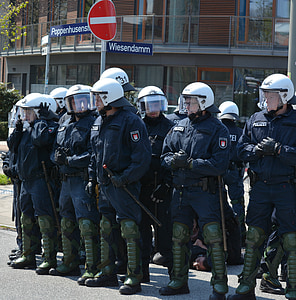 police men standing on road at daytime thumbnail