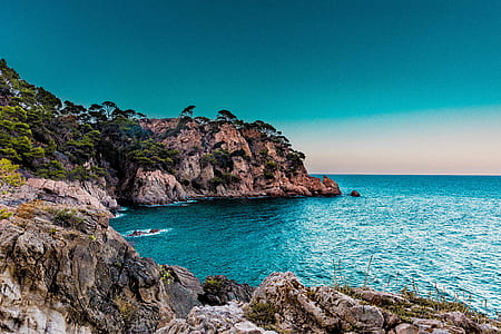 landscape of seashore under blue sky thumbnail