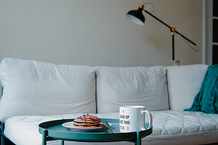 white ceramic mug on top of blue side table thumbnail