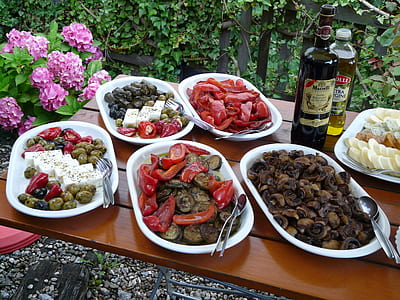cooked food on white plate beside liquor bottle on table thumbnail