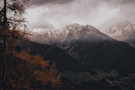 black mountain covered by snow during daytime thumbnail