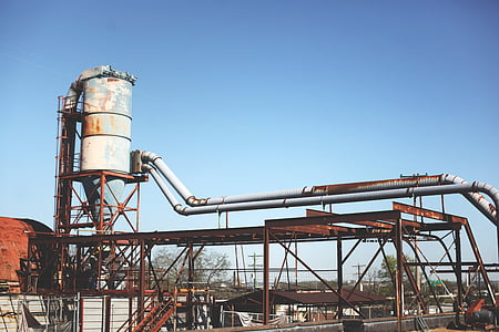 white industrial tank on top of platform under clear sky thumbnail