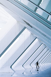 man standing near slanting walls thumbnail