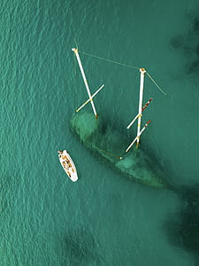 aerial photography of white boat on body of water thumbnail