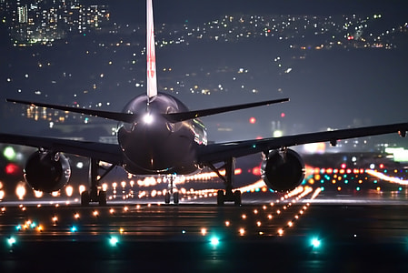low light photographed of gray plane on pathway thumbnail