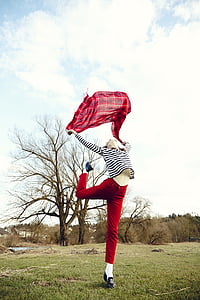 woman wearing red denim pants and white striped sweater thumbnail