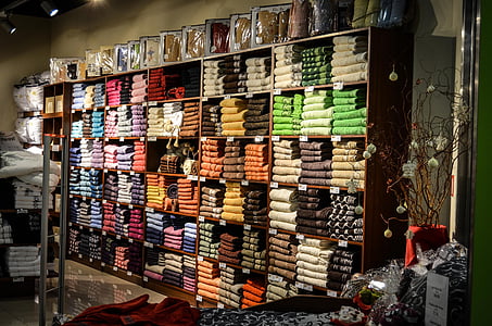 assorted-color clothes lot in shelves thumbnail