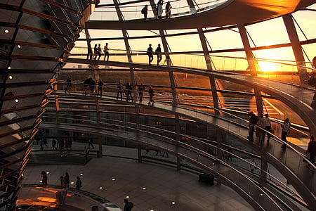 people inside brown glass building thumbnail