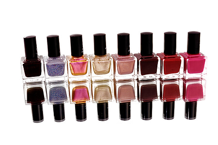 eight assorted-color nail polish bottles reflective photography thumbnail
