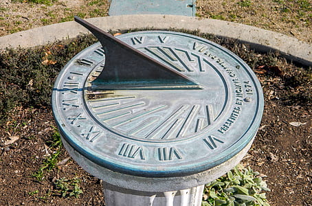round metal sundial at 12 thumbnail