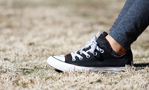 shallow focus photography of pair of black-and-white low-top sneakers thumbnail