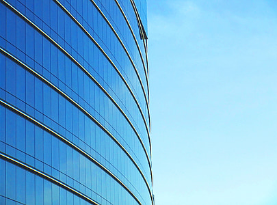 photo of concrete building under blue sky at daytime thumbnail