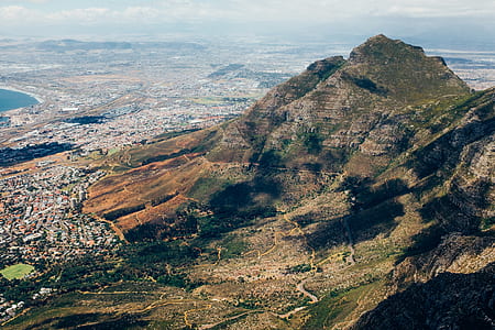 aerial photography of mountain near village at daytime thumbnail