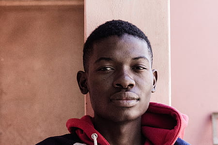 man wearing red and blue hoodie top thumbnail