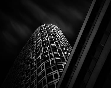 grayscale low-angle photography of high-rise building thumbnail