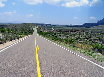 Gray Concrete Road With White Safety Line during Daytime thumbnail