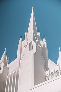 white concrete building under blue sky thumbnail
