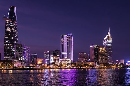 photo of lighted high-rise building during nighttime thumbnail