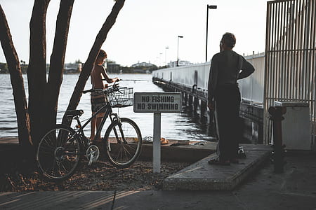 two person standing near dock thumbnail