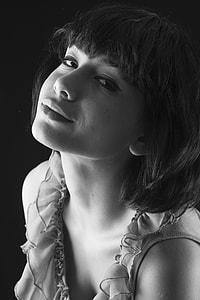 grayscale portrait photography of short-haired woman thumbnail