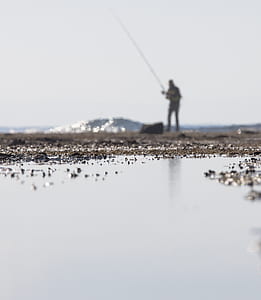 selective focus photography of water on sand thumbnail