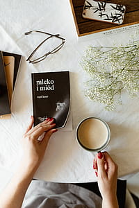 Woman read book and drink coffee thumbnail
