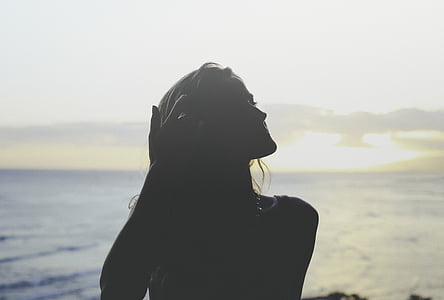 silhouette view of woman at the beach thumbnail